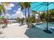 Landscaped backyard with pool, dock, and waterfront views at 4917 Marlin Dr, New Port Richey, FL 34652
