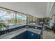 Outdoor bar area with seating overlooking pool and palm trees at 4917 Marlin Dr, New Port Richey, FL 34652