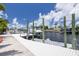 View of private boat dock with multiple boat slips and waterfront views at 4917 Marlin Dr, New Port Richey, FL 34652