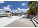 Private boat dock with seating, a boat, and waterfront access at 4917 Marlin Dr, New Port Richey, FL 34652
