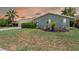 Charming single Gathering home with tropical landscaping, a two car garage, and brick exterior at 4917 Marlin Dr, New Port Richey, FL 34652