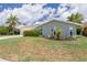 Charming single Gathering home featuring an attached two car garage, chimney, and beautifully landscaped front yard at 4917 Marlin Dr, New Port Richey, FL 34652