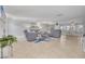 Bright and airy living room with plush seating, stylish decor, and tile flooring at 4917 Marlin Dr, New Port Richey, FL 34652
