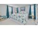 A beautiful main bedroom with coastal decor, soft lighting, and comfortable furnishings at 4917 Marlin Dr, New Port Richey, FL 34652