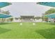 Expansive outdoor venue on manicured grass, featuring a stage and covered seating areas, perfect for events at 4917 Marlin Dr, New Port Richey, FL 34652