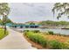 Picturesque waterfront view with a vibrant blue bridge, lush greenery, and a peaceful river scene at 4917 Marlin Dr, New Port Richey, FL 34652