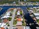Wide aerial shot shows canal front homes with private docks in a scenic waterfront community at 4937 Dory Dr, New Port Richey, FL 34652