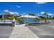 Community beach bathhouse features bathroom access and outdoor seating to take in the breathtaking coastal views at 4937 Dory Dr, New Port Richey, FL 34652