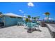 Charming beachside patio features multiple outdoor seating areas to sit back, relax, and take in the gorgeous coastal views at 4937 Dory Dr, New Port Richey, FL 34652
