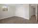 Bright bedroom features neutral walls, a closet, and tile flooring, creating a clean and inviting space at 4937 Dory Dr, New Port Richey, FL 34652
