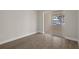 Bedroom with sliding glass doors offering access to outdoor area at 4937 Dory Dr, New Port Richey, FL 34652