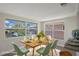 Dining area bathed in natural light with large windows overlooking the waterfront at 4937 Dory Dr, New Port Richey, FL 34652