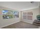 Dining area bathed in natural light with large windows overlooking the waterfront at 4937 Dory Dr, New Port Richey, FL 34652