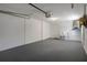 Spacious garage with ample storage space and a utility sink for added convenience at 4937 Dory Dr, New Port Richey, FL 34652