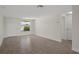 Bright living area with fresh paint, tile flooring and a window view at 4937 Dory Dr, New Port Richey, FL 34652