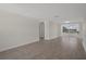 Bright living room with neutral walls and tiled floors; ready to be styled at 4937 Dory Dr, New Port Richey, FL 34652