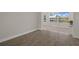 Open and airy living space featuring neutral walls, tile flooring and natural light at 4937 Dory Dr, New Port Richey, FL 34652
