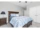 This cozy bedroom has a comfortable bed, wooden furniture and neutral tones for a peaceful ambiance at 5001 Night Star Trl, Odessa, FL 33556