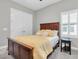 Bright bedroom with closet and plantation shutters offers a comfortable and stylish space at 5001 Night Star Trl, Odessa, FL 33556