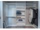 Organized closet featuring shelving, hanging rods, and ample storage space at 5001 Night Star Trl, Odessa, FL 33556