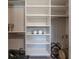 Walk-in closet with shelving for folded items and accessories at 5001 Night Star Trl, Odessa, FL 33556