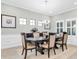 Formal dining room with trim package, chandelier, and plenty of natural light at 5001 Night Star Trl, Odessa, FL 33556