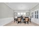 Elegant dining room with wainscoting, trim package, and shuttered windows at 5001 Night Star Trl, Odessa, FL 33556