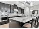 Beautiful kitchen features stainless steel appliances, a spacious island, and ample cabinet space at 5001 Night Star Trl, Odessa, FL 33556