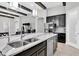 Gourmet kitchen with large island, stainless steel appliances, and custom cabinetry at 5001 Night Star Trl, Odessa, FL 33556