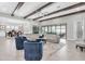 Spacious living room featuring high ceilings with wood beams, neutral color palette and plenty of seating at 5001 Night Star Trl, Odessa, FL 33556