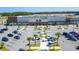 Aerial view of a commercial center showcasing ample parking and a variety of retail stores, including a grocery store at 5001 Night Star Trl, Odessa, FL 33556
