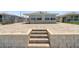 Paved patio area in backyard that leads down to the waterfront; chain link fence in place at 5045 Pelican Dr, New Port Richey, FL 34652