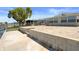 Large brick paved patio leading to waterfront with mature landscaping and water views at 5045 Pelican Dr, New Port Richey, FL 34652