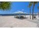 Beachside pavilion with picnic tables under a white roof offering a relaxing spot to enjoy the ocean view at 5045 Pelican Dr, New Port Richey, FL 34652