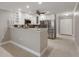 Spacious kitchen boasting stainless steel appliances, a breakfast bar, and ample cabinet space at 5045 Pelican Dr, New Port Richey, FL 34652
