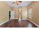 Relaxing bedroom featuring wood floors, neutral walls, and large windows for abundant natural light at 5487 Valley View Dr, Brooksville, FL 34601
