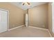 Serene bedroom with neutral walls, carpet flooring, a closet, and a window, creating a calm atmosphere at 5487 Valley View Dr, Brooksville, FL 34601