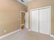 Cozy bedroom featuring neutral walls, carpet flooring, a closet, and a window for natural light at 5487 Valley View Dr, Brooksville, FL 34601