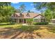 Charming single-Gathering home with a well-maintained lawn, mature trees, and welcoming curb appeal at 5487 Valley View Dr, Brooksville, FL 34601