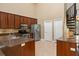 Spacious kitchen with granite counters, stainless steel appliances, and ample cabinet storage at 5487 Valley View Dr, Brooksville, FL 34601