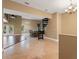 Open floor plan showcasing a living area with a spiral staircase and tile floors at 5487 Valley View Dr, Brooksville, FL 34601