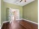 Inviting living room featuring hardwood floors and a view through french doors at 5487 Valley View Dr, Brooksville, FL 34601