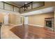 The beautiful living room boasts wood floors, a fireplace, and easy access to the outside through French doors at 5487 Valley View Dr, Brooksville, FL 34601