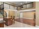 Spacious living area with a spiral staircase, soaring ceilings, and access to the outdoor area at 5487 Valley View Dr, Brooksville, FL 34601