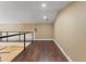 Loft area with railing, hardwood floors, and bright lighting overlooking the floor below at 5487 Valley View Dr, Brooksville, FL 34601