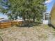 Backyard featuring a new wooden fence, large shady trees, and access to pool at 6028 Dorset Rd, Spring Hill, FL 34608