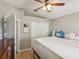 Bedroom with closet, full-length mirror, and a window to let in natural light at 6028 Dorset Rd, Spring Hill, FL 34608