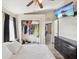 Bedroom with TV, closet, ceiling fan, and ensuite bathroom at 6028 Dorset Rd, Spring Hill, FL 34608