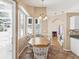 Cozy breakfast nook with a table and chairs, adjacent to the kitchen at 6028 Dorset Rd, Spring Hill, FL 34608