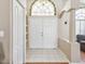 Spacious entryway features double doors, decorative accents, tile flooring and natural light at 6028 Dorset Rd, Spring Hill, FL 34608